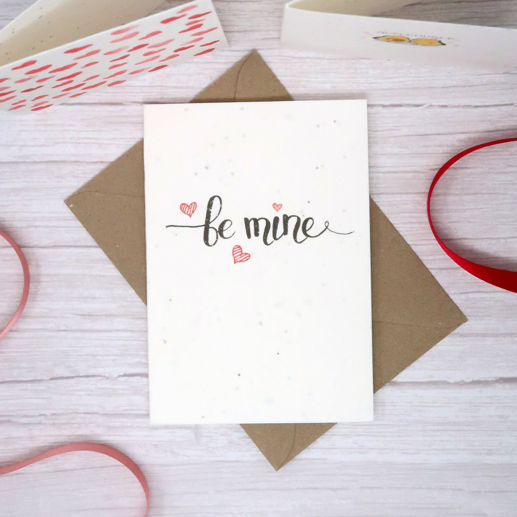 valentine card with be mine text on the front and love hearts