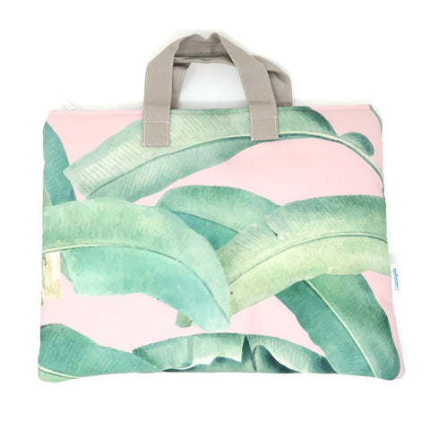 pink laptop case with green leaf pattern
