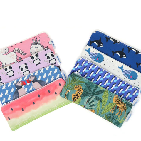 colourful printed penicl cases spreadout with animal and fruit pattern designs