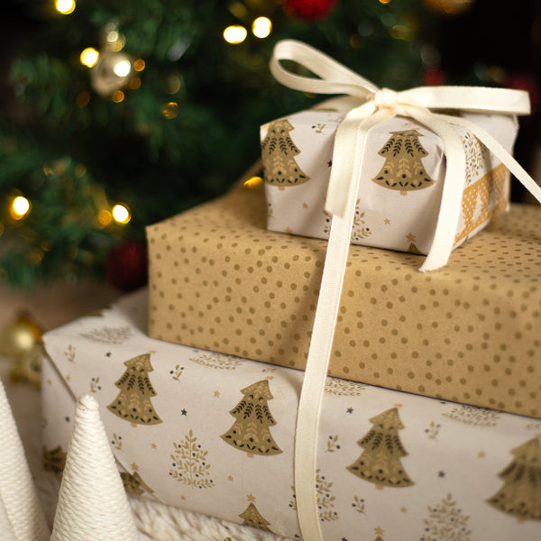 Gifts wrapped in festive paper with Christmas tree designs, tied with ribbons, against a Christmas tree background.