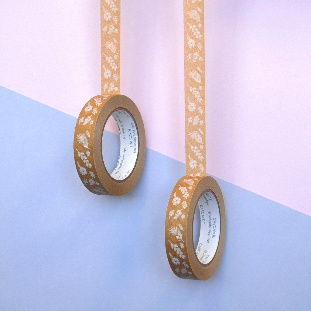 Two rolls of decorative tape with floral  & Fern patterns on a pastel background