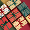 Assorted Christmas gift boxes with ribbons on a red background