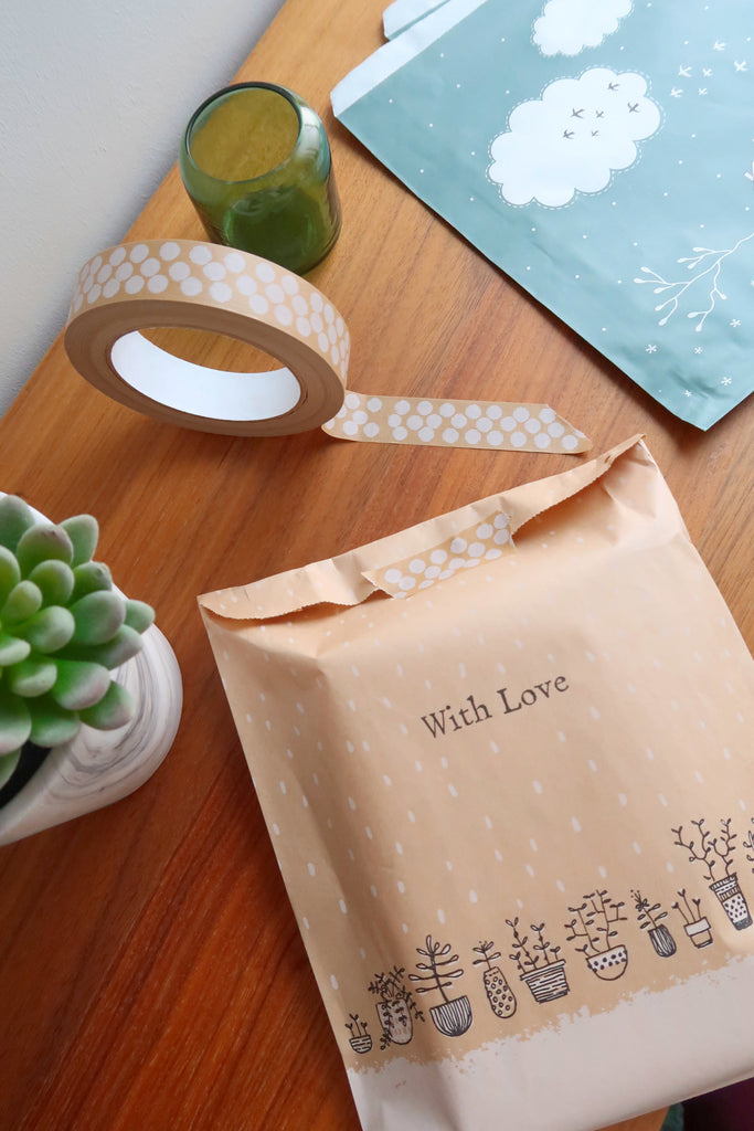 paper gift bags with plants design and white paper tapes