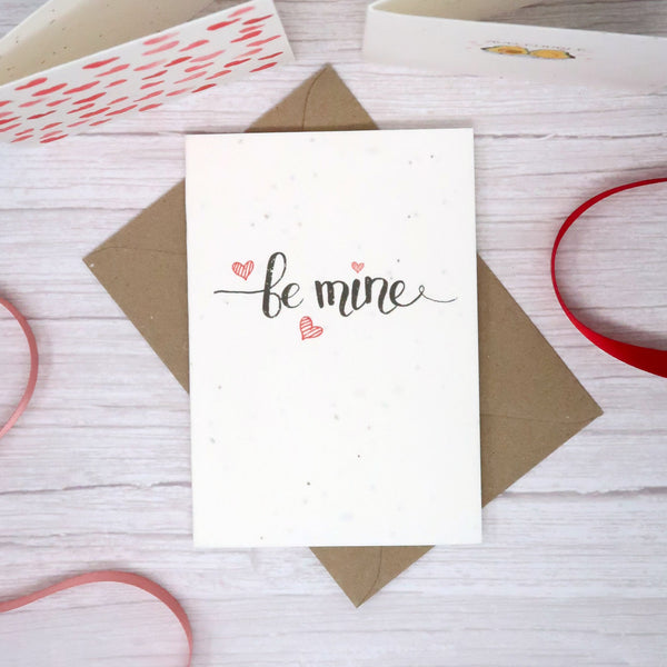 valentine card with be mine text on the front and love hearts 