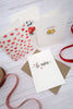 valentine cards spread on a white wooden table top