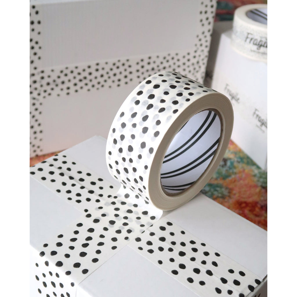White paper tape with black dots on white boxes