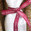 white honeycomb wrap with red merry Christmas ribbon